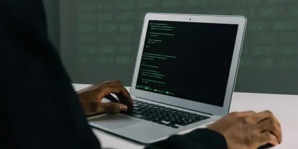 Code on laptop screen showing hacker trying to breach an enterprise
