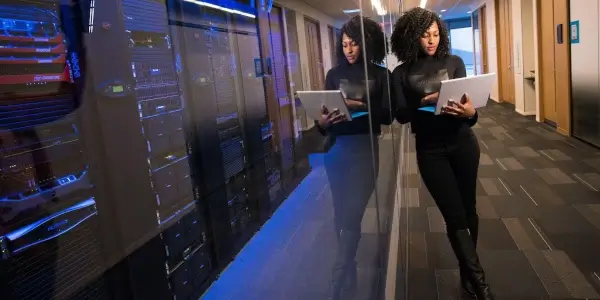 woman with a laptop monitors servers